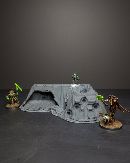 Sci-fi ruined military command bunker terrain with miniatures for tabletop wargaming